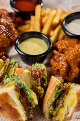 Variety of foods and condiments on a white plate