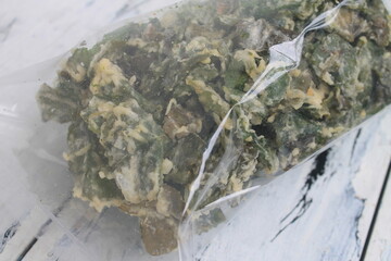 Indonesian Food called rendeng chips in plastic on the table

