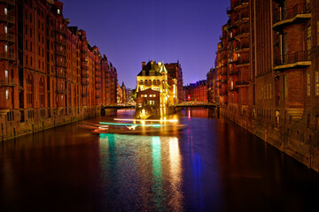 Naklejka premium Water castle in Speicherstadt, Hamburg, Germany, seen from Poggenmuhlen Bridge.