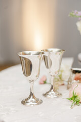 a wedding reception table set with champagne glasses and flowers on it