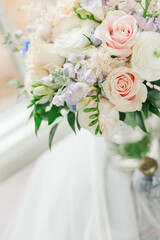 Lovely wedding reception bouquet on a window sill