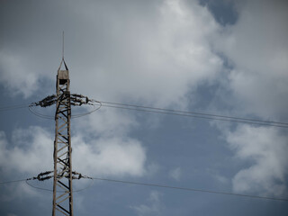 Aged Power Mast Standing Tall, Symbolizing Industrial History and Technological Progress