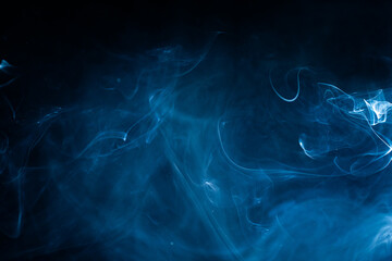 Soft blue fog haze on dark background. Abstract atmospheric smoke cloud. High quality photo