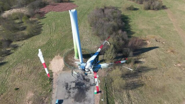 Aerial footage of a broken wind generator in a wind farm on a sunny day in Taurage, Lithuania