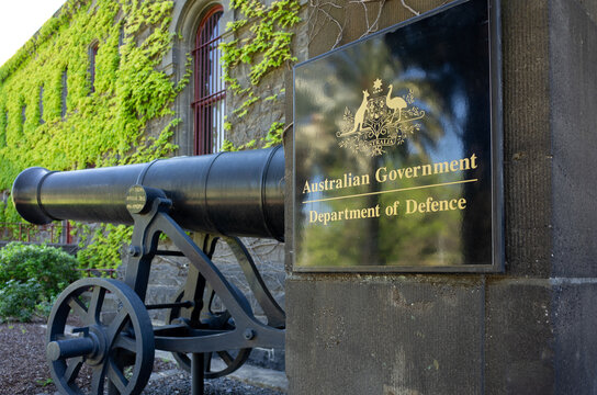 The emblem of the Australian Government outside the RAAF AIS Department of Defence building, Melbourne VIC Australia. The department is responsible for defending Australia and its national interests.