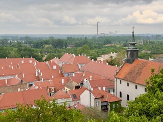 Scenic view of red rooftops with green trees in the old town of Petrovaradin, Serbia