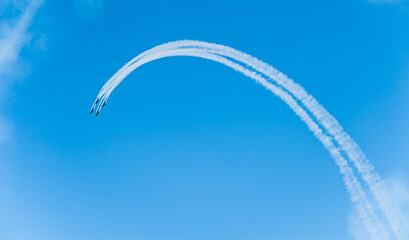 Jet airplane display group performing aerobatic manoeuvrers.