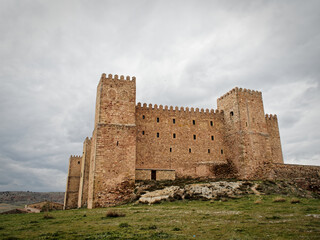 Medieval castle with atop a lush hill in Siguenza, Spain