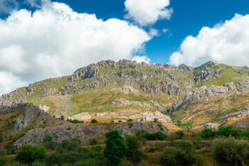 Scenic view of Asturias, Spain's rocky mountains on a cloudy day with vibrant colors