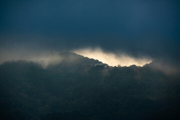 cloudy sunset over salak mountain, gunung salak, with dark color mood