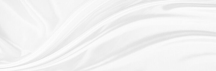 White gray satin texture that is white silver fabric silk background with beautiful soft blur pattern natural.