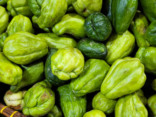 Fresh chayote on display and for sale at a traditional market
