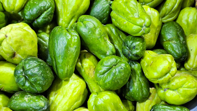 Fresh chayote on display and for sale at a traditional market