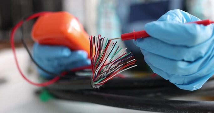 Multimeter check quality of network wiring closeup. Work as electrician concept