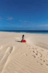 person sitting on the beach