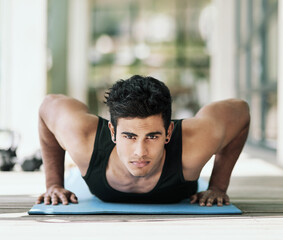 Obraz premium Portrait, man and push up on yoga mat for wellness, health and exercise in fitness, sports and cardio. Male person, athlete and home gym for training, muscle and endurance for body or challenge