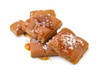 Yummy caramel candies and sea salt isolated on white