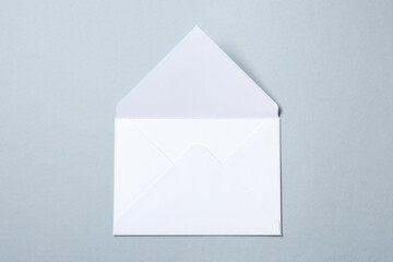 Letter envelope on grey background, top view