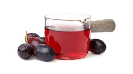 Wine vinegar and grapes isolated on white
