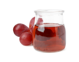 Wine vinegar in jar and grapes isolated on white