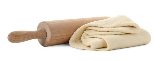 Raw dough and rolling pin isolated on white