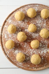 Shortcrust pastry. Raw dough balls on white wooden table, top view