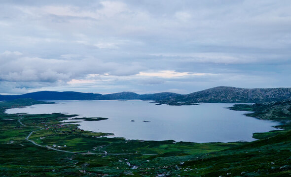 View of Vinstre lake situated in Jotunheimen, with Jotunheimvegen road running along the northern shore