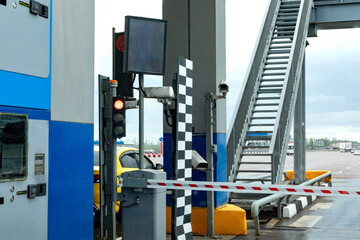 Checkpoint on the toll road. Payment area with transport. Bus and lorry truck on roadway. Point...