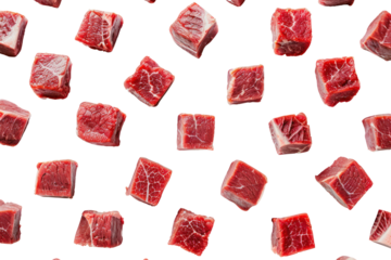 Raw beef meat cubes scattered across a white surface, like dice on a game board, isolated on white background
