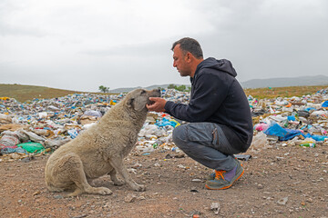 The man who loves a stray dog at the city dump.