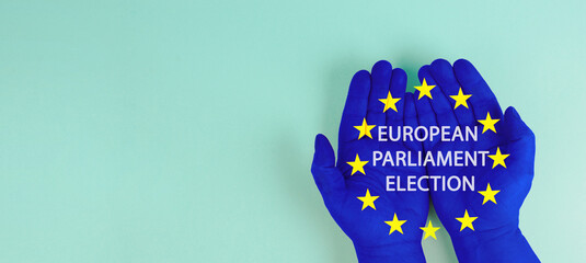 EU election, hands with european union flag, blue and yellow stars, citizens of Europe voting Parliament