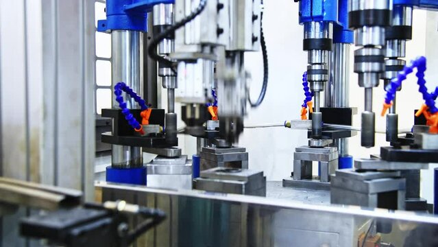 CNC machine drill on metal in a factory