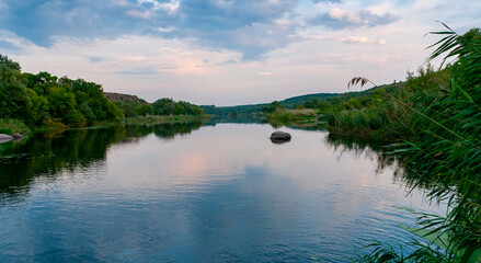 Old floodplain forest along the banks of the Southern Bug River in a granite canyon, Ukraine