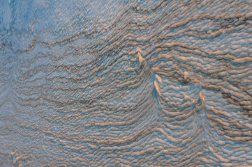 Wavy dirty foam near the shore in Tuzlovsky estuary, Ukraine