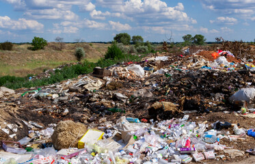 Pollution of nature, spontaneous garbage dump in the field, environmental problem of Ukraine