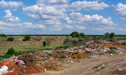 Pollution of nature, spontaneous garbage dump in the field, environmental problem of Ukraine