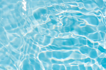 Blue water with ripples on the surface. Defocus blurred transparent blue colored clear calm water...