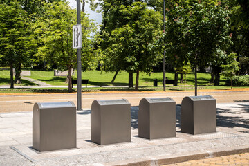 Modern underground trash containers in city area