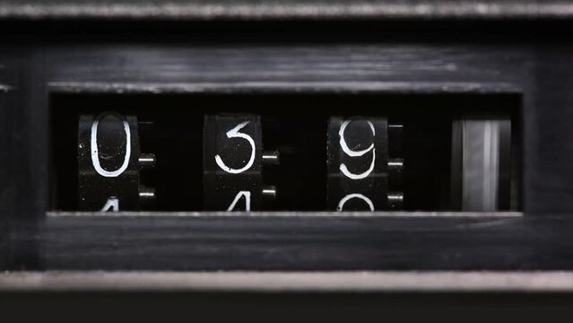 Old mechanical counter counts numbers from 0 to 2350, macro shot 4k