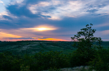 Orange sunset with clouds over the shore Tiligul Estuary, Ukraine