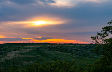 Orange sunset with clouds over the shore Tiligul Estuary, Ukraine