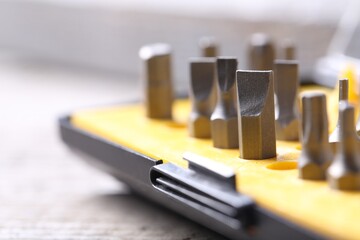 Screwdriver bit set on blurred background, closeup