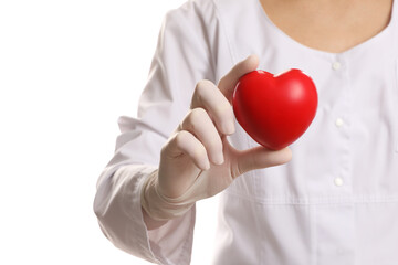 Doctor in medical glove holding red heart on white background, selective focus