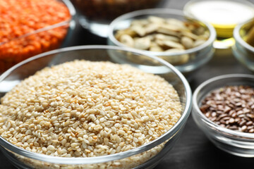 Sesame seeds in bowl on table, closeup. Healthy fats