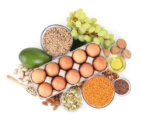 Different nuts, seeds and products high in healthy fats isolated on white, top view