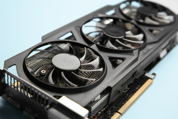 One graphics card on light blue background, closeup