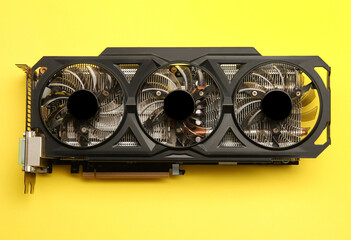 One graphics card on yellow background, top view