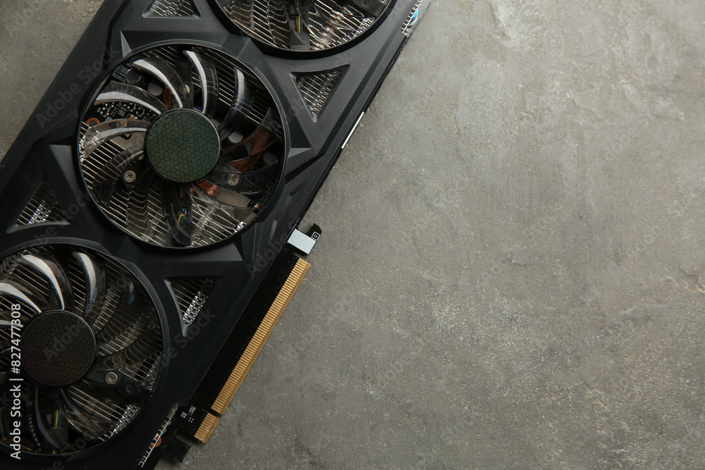 Fototapete one graphics card on grey table, top view. space for text