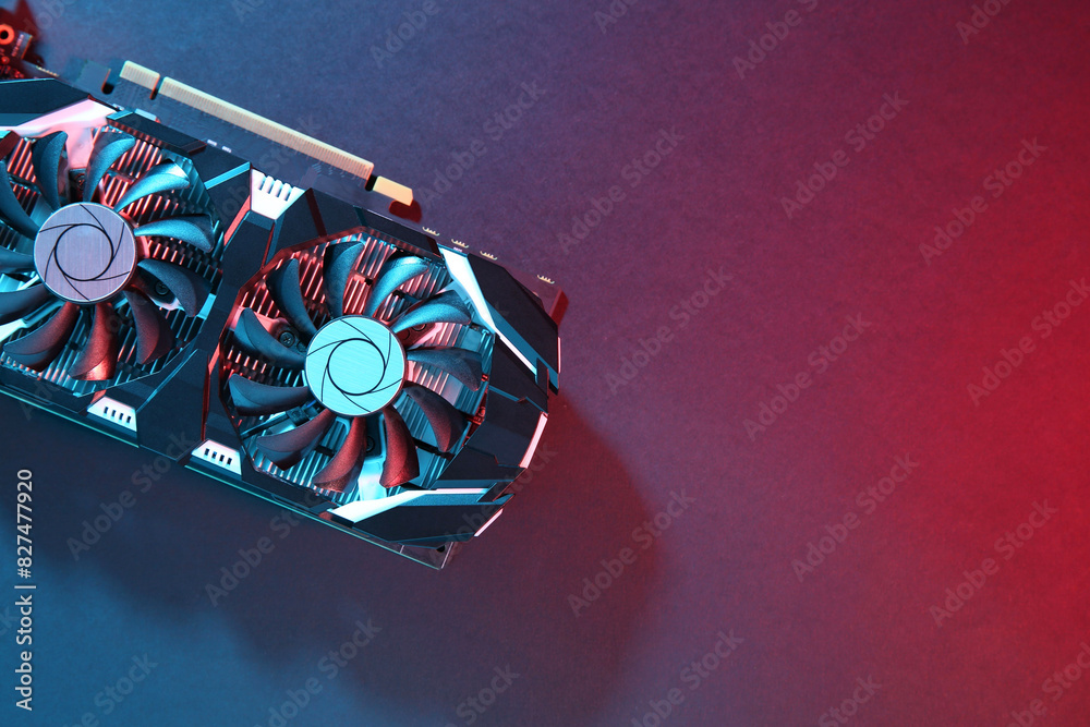 Fototapete computer graphics card on color background, top view. space for text
