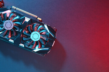 Computer graphics card on color background, top view. Space for text